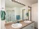 Double vanity bathroom with a shower and separate tub at 19805 E 58Th Pl, Aurora, CO 80019