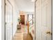 Bright entryway with hardwood floors and access to stairs at 19805 E 58Th Pl, Aurora, CO 80019