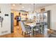 Eat-in kitchen with stainless steel appliances and wood cabinetry at 19805 E 58Th Pl, Aurora, CO 80019