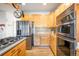 Bright kitchen, stainless steel appliances, and light wood cabinets at 19805 E 58Th Pl, Aurora, CO 80019