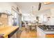 Open kitchen with breakfast bar and view into the living room at 19805 E 58Th Pl, Aurora, CO 80019