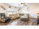 Spacious living room with sectional sofa and large TV at 19805 E 58Th Pl, Aurora, CO 80019