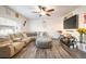 Living area featuring a sectional sofa and flat-screen TV at 19805 E 58Th Pl, Aurora, CO 80019