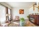 Living room with fireplace, seating area, and natural light at 19805 E 58Th Pl, Aurora, CO 80019
