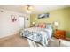 Main bedroom with king bed and ensuite access at 19805 E 58Th Pl, Aurora, CO 80019