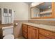 This bathroom has a beautiful granite countertop on the vanity and decorative tiles on the wall at 4510 E 121St Pl, Thornton, CO 80241
