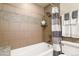 Nicely tiled bathroom features a bathtub with shower, a shower curtain, and a white vanity at 4510 E 121St Pl, Thornton, CO 80241