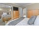 Light-filled bedroom with mirrored closet doors and built-in wardrobe provides extra storage space at 4510 E 121St Pl, Thornton, CO 80241