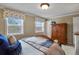 Comfortable bedroom featuring large windows, neutral walls, and a spacious wardrobe for ample storage at 4510 E 121St Pl, Thornton, CO 80241