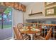 Cozy breakfast nook with sliding door to the patio and open view to the living room at 4510 E 121St Pl, Thornton, CO 80241