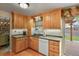 Bright eat-in kitchen features wood cabinets, gray countertops and sliding door to the exterior at 4510 E 121St Pl, Thornton, CO 80241