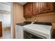 Practical laundry room with washer, dryer, and ample cabinet storage at 4510 E 121St Pl, Thornton, CO 80241