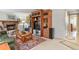 Spacious living room features built-in shelving and fireplace with stylish decor at 4510 E 121St Pl, Thornton, CO 80241