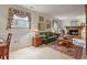 Comfortable living room features a brick fireplace, wood trim and stylish decor at 4510 E 121St Pl, Thornton, CO 80241