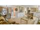 Open-concept living and dining area with stylish furnishings, neutral colors, and plenty of natural light at 4510 E 121St Pl, Thornton, CO 80241