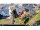 Aerial view of the home's backyard featuring a spacious lawn and wooden deck at 5171 E 119Th Ct, Thornton, CO 80233