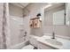 Bright, renovated bathroom featuring a shower and tub combination with white patterned shower curtain at 815 Columbine Rd # 22, Breckenridge, CO 80424