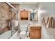 Renovated bathroom with light wood cabinets, shower and tub combination at 815 Columbine Rd # 22, Breckenridge, CO 80424