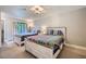 Bright bedroom featuring two beds with colorful quilts, neutral walls and modern light fixture at 815 Columbine Rd # 22, Breckenridge, CO 80424