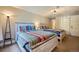 Bright bedroom featuring two beds with colorful quilts and modern light fixture at 815 Columbine Rd # 22, Breckenridge, CO 80424