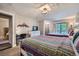 Bright bedroom with colorful quilts, desk, dresser and balcony access at 815 Columbine Rd # 22, Breckenridge, CO 80424