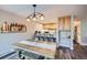 Cozy dining area with a wooden table, bench seating, and a view of the kitchen bar at 815 Columbine Rd # 22, Breckenridge, CO 80424
