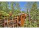 Multi-level building surrounded by trees and balconies at 815 Columbine Rd # 22, Breckenridge, CO 80424