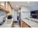 Well-equipped kitchen with granite countertops, stainless steel appliances, and wooden cabinets at 815 Columbine Rd # 22, Breckenridge, CO 80424