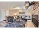 Comfortable living room featuring a stone fireplace, large sectional sofa, and modern decor at 815 Columbine Rd # 22, Breckenridge, CO 80424