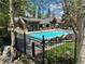 Community pool surrounded by a black fence at 815 Columbine Rd # 22, Breckenridge, CO 80424