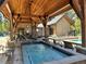 Community pool area with hot tubs and wooden pergola for shade at 815 Columbine Rd # 22, Breckenridge, CO 80424