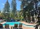 Community pool with plenty of trees providing shade and lounge chairs for relaxing at 815 Columbine Rd # 22, Breckenridge, CO 80424