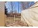 Cozy patio area enclosed by a metal railing, perfect for outdoor relaxation at 4203 Owens St, Wheat Ridge, CO 80033