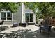 Shaded back deck with cozy seating, BBQ grill, and tree coverage creating a relaxing atmosphere at 6401 S Forest St, Centennial, CO 80121