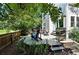 Expansive back deck with comfortable seating, grill, and lush greenery, ideal for outdoor entertaining at 6401 S Forest St, Centennial, CO 80121