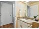 Well-lit bathroom features a granite countertop vanity with ample cabinet space at 6401 S Forest St, Centennial, CO 80121