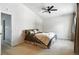 Bedroom with a ceiling fan, ensuite bath, and a neutral color palette at 6401 S Forest St, Centennial, CO 80121