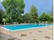 Large community pool with lounge chairs for relaxing and enjoying the sunshine at 6401 S Forest St, Centennial, CO 80121