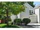 Charming two-story home with a well-maintained lawn, mature tree, and a two car garage at 6401 S Forest St, Centennial, CO 80121