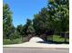 Charming footbridge on walking trail surrounded by mature trees and community greenspace at 6401 S Forest St, Centennial, CO 80121
