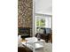 Cozy living room showcases a stone fireplace and natural light from the window at 6401 S Forest St, Centennial, CO 80121