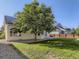 Large backyard with mature trees and patio at 370 Terra Vista St, Brighton, CO 80601