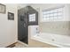 Bathroom with a large walk-in shower and soaking tub at 370 Terra Vista St, Brighton, CO 80601