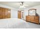 Basement bedroom with double doors and wood furniture at 370 Terra Vista St, Brighton, CO 80601