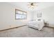 Comfortable bedroom with a queen-size bed and ceiling fan at 370 Terra Vista St, Brighton, CO 80601