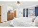 Spacious bedroom with wood dresser and window at 370 Terra Vista St, Brighton, CO 80601