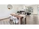 Dining area with a wooden table and chairs near a fireplace at 370 Terra Vista St, Brighton, CO 80601