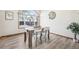 Dining area with a wooden table and chairs, and a view to the backyard at 370 Terra Vista St, Brighton, CO 80601