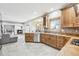 Spacious kitchen with wood cabinets, granite countertops and stainless steel appliances at 370 Terra Vista St, Brighton, CO 80601