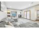 Spacious living room featuring a gray sectional sofa and a fireplace at 370 Terra Vista St, Brighton, CO 80601